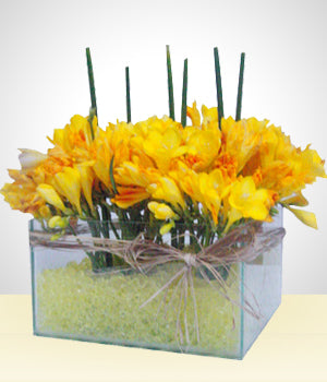 Glass Bowl Flower Arrangement with yellow gel filling